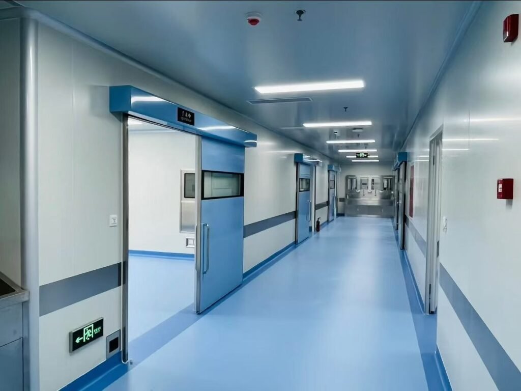 A sterile cleanroom corridor featuring OSIDEK's custom automated hermetic sliding doors for a dental clinic's CT shielding and purification project.
